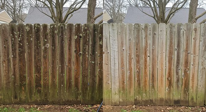 old wooden fence with grass, Pressure washing cleaning wooden fence. Difference between clean dirty surface. Moss, algae, mildew removal from old weathered wood fence. Home improvement renovation, bac