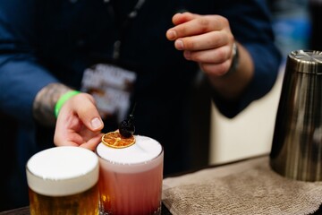 Craft cocktail creation at a vibrant bar during an evening event