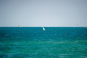 windsurfer and lighthouse on the sea in Pomorie, Bulgaria