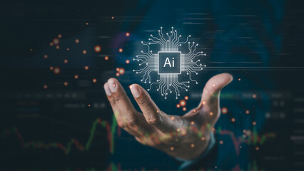 A hand holds a glowing AI microchip symbol with circuit lines, symbolizing artificial intelligence...