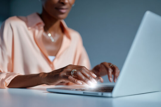 Businesswoman working late at night on laptop computer