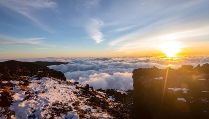 Mountain sunrise above clouds with snow high resolution photo