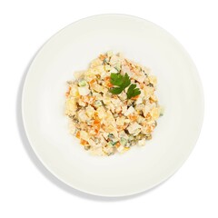 A pristine white plate artfully topped with a fresh salad on a white background
