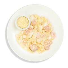 Pasta with salmon on a white plate with parmesan cheese on a white background Italian dish