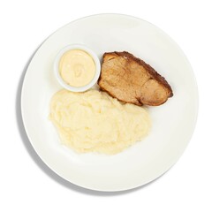 A white plate topped with creamy mashed potatoes and juicy meat