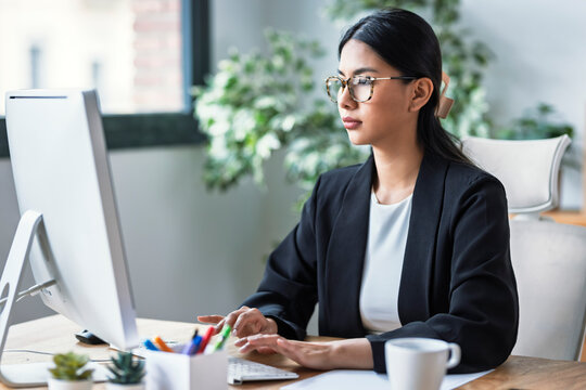 Young entrepreneur working at a computer in a modern office