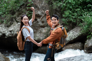 Celebrating Nature. Happy hikers rejoicing after reaching a scenic spot.