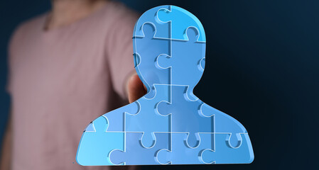 Abstract image of a person made of puzzle pieces, symbolizing teamwork, unity, and collaboration.