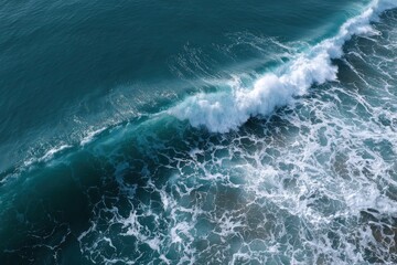 Ocean wave with white foam crests and turbulent surface textures