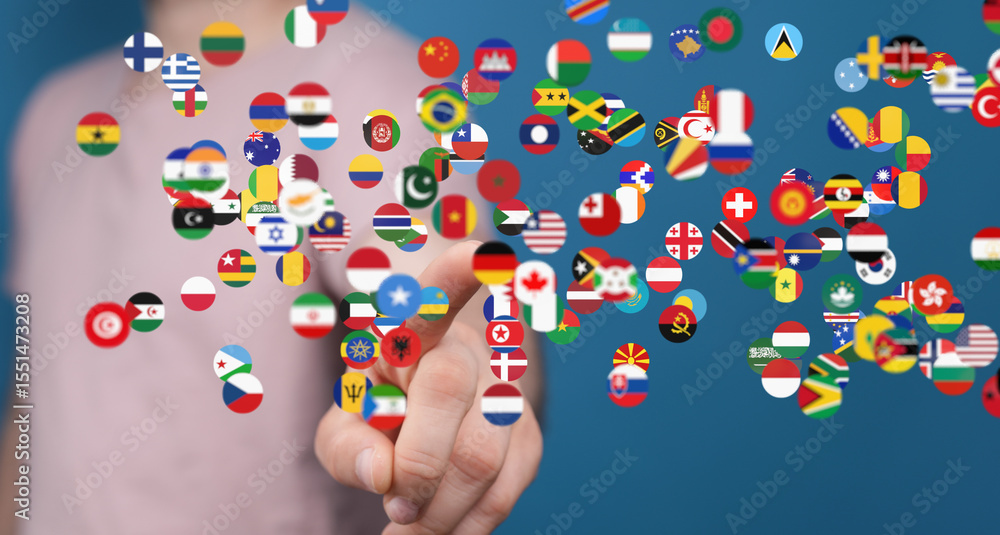 Aufkleber Hand interacting with a digital display of world flags, symbolizing global connection and networking.