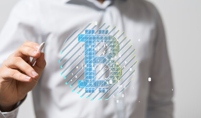 Stock photo of a businessman presenting a digital Bitcoin symbol. Perfect for cryptocurrency,...