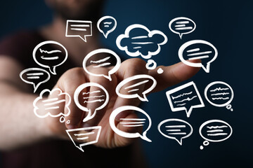 Abstract image of hand interacting with digital speech bubbles, representing communication and...