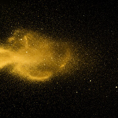 Obraz premium Gold glitter explosion against a black background. Abstract glitter particles in a dynamic pattern. High-quality image perfect for commercial use.