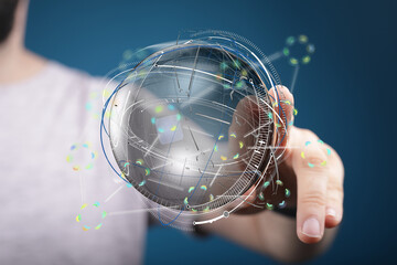 Person interacting with a digital globe, representing global connectivity and technological...