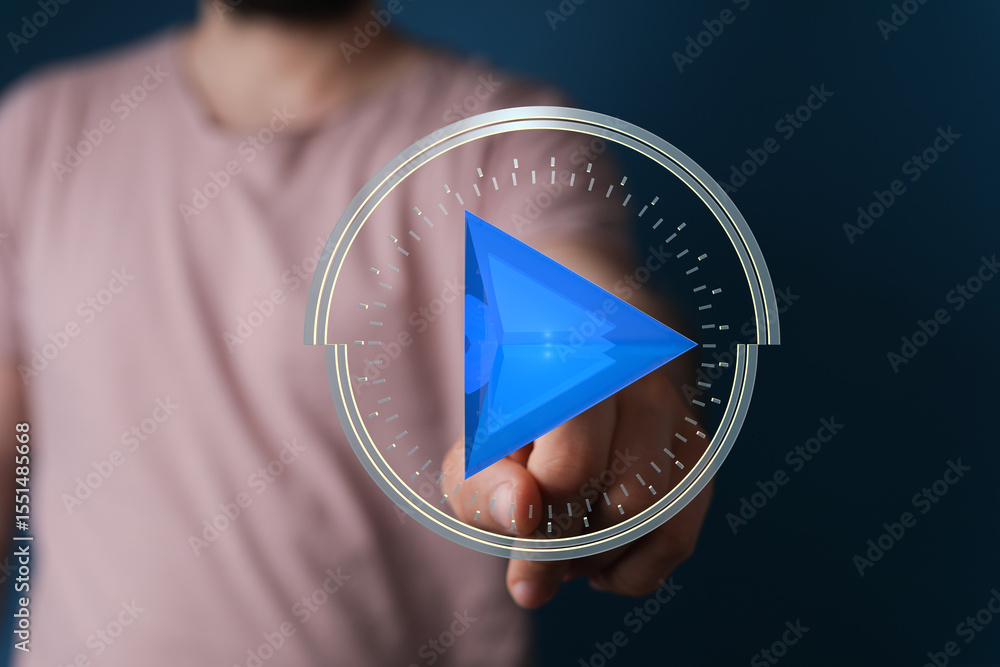Poster Abstract image of a person interacting with a digital play button interface.  Modern technology concept.