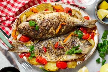 Baked Dorado with Vegetables, Potatoes, Sweet Peppers, Cherry Tomatoes, Onions and Garli..top veiw