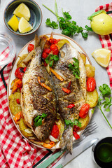 Baked Dorado with Vegetables, Potatoes, Sweet Peppers, Cherry Tomatoes, Onions and Garli..top veiw