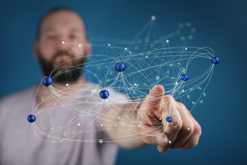A man interacts with a holographic network, showcasing connection and data visualization.