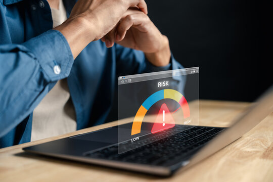 Risk management control system showing high-risk alert level with gauge and warning on screen. Ideal for cybersecurity, business monitoring, financial risk, and system alert content.