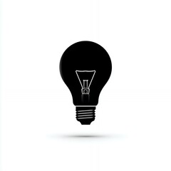 Obraz premium A light bulb is shown in black and white. The light bulb is a symbol of illumination and knowledge