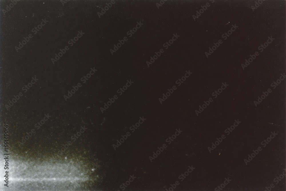 Poster a dark and grainy image with a light area at the bottom left corner edge