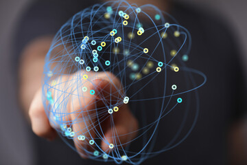 Hand interacting with a digital network, representing connection and global communication.