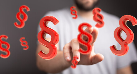 Red paragraph symbols float around a person's hand, symbolizing legal concepts and understanding the law.