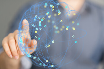 Abstract image depicting a hand interacting with a digital network sphere, representing global...