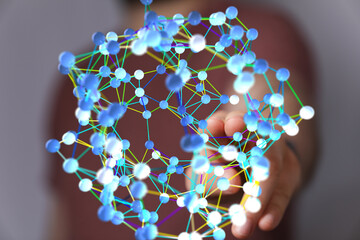 Abstract image of a hand interacting with a digital network. Represents connection, technology, and...