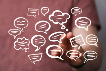 Hand interacting with digital speech bubbles,communication, conversation, networking, social media...