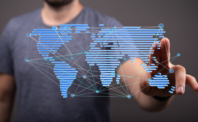 High-tech image of a man interacting with a digital world map, showcasing global connectivity and...