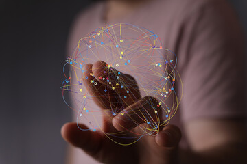 Abstract image of a hand interacting with a digital network. Represents connectivity, technology,...