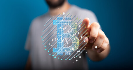 Close-up of a person's hand interacting with a digital Bitcoin symbol, representing cryptocurrency...