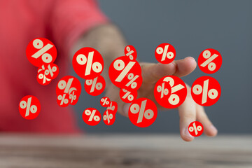 Image of a hand reaching towards floating percentage symbols, ideal for sales, discounts, and...