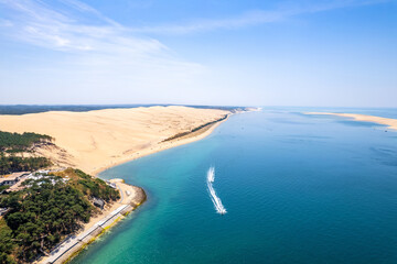 Aerial view of the Dune of Pilat, the highest sand dune in Europe, located in La Teste-de-Buch in Arcachon Bay, France, southwest of Bordeaux, along the Atlantic coast of France on a sunny day