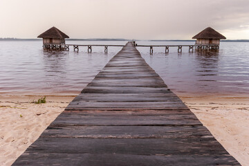 Wooden pier leading to overwater bungalows on Lake Ampitabe, in Andranokoditra, along the...