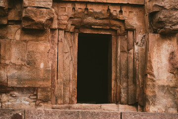 Ancient stone doorway of a temple at Badami, Karnataka, India, showcasing traditional Indian...