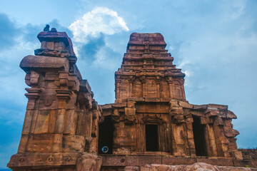 Ancient temple in Badami, Karnataka. The overcast sky adds intensity to the rugged terrain and the...