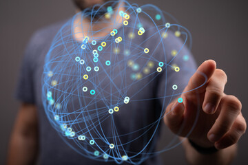 Abstract image of a person interacting with a digital network. Represents connection, technology,...
