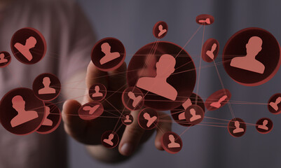 Hand interacting with a network of digital profiles, symbolizing connections and community.