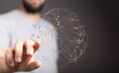 Abstract image of a hand interacting with a digital network sphere, representing global...