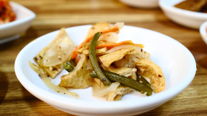 Korean pickled mixed vegetables banchan with tofu and green beans in light seasoning served as healthy traditional side dish