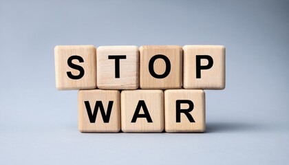 wooden blocks with bold black letters spelling stop war on a neutral gray background for peace campaign design, protest graphic, or editorial article illustration

