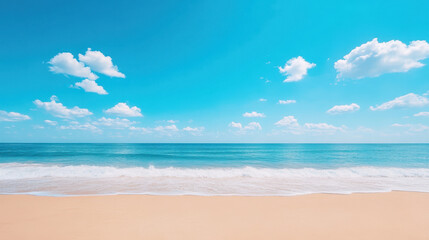 A beautiful beach with a clear blue sky and a few clouds
