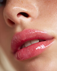 Glossy pink lips glisten under soft natural light, showcasing radiant and youthful appearance. close up highlights smooth texture and vibrant color, evoking sense of beauty and freshness