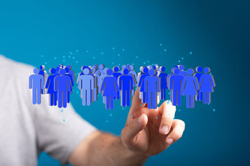 Image depicts a hand interacting with a network of diverse people, symbolizing global community,...