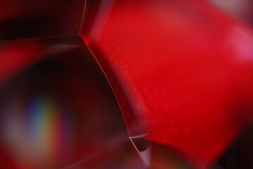 Red reflections of liquid in macro, red liquid surface, bubbles in macro, connection of bubbles in...