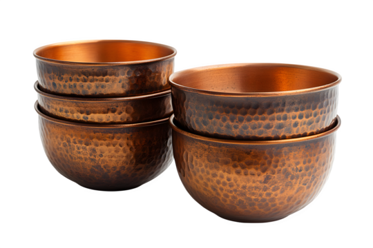 Copper measuring cups nested together isolated on white background