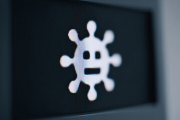 Blurred computer screen showing virus warning popup, digital security alert signaling malware threat, ransomware or phishing attack
