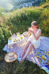 Beautiful picnic scene with fresh fruits, drinks, and cozy summer vibes